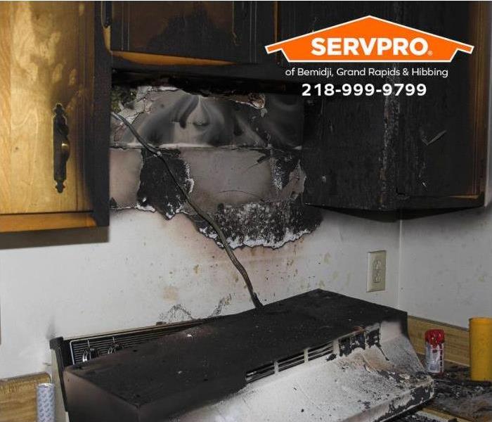 A fire-damaged kitchen is shown.