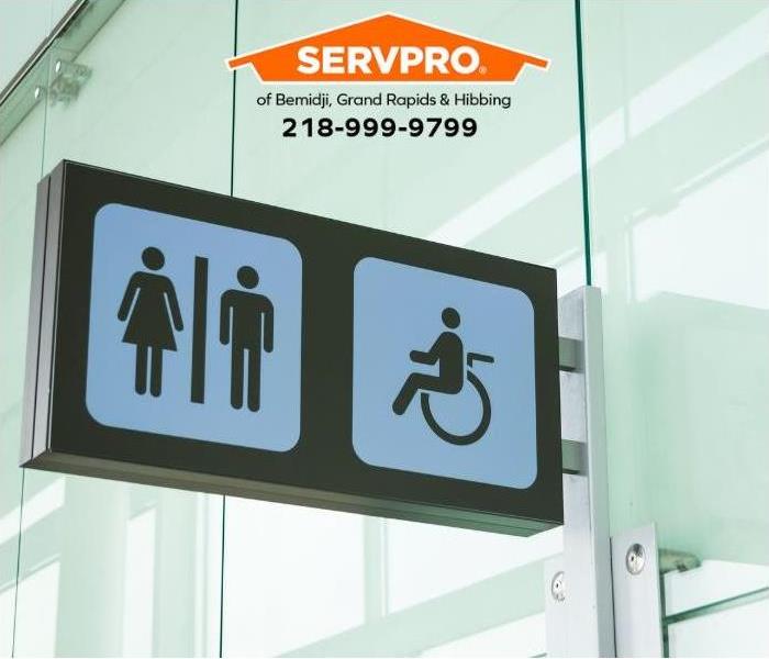 Public restroom icon signs for a commercial property is shown.